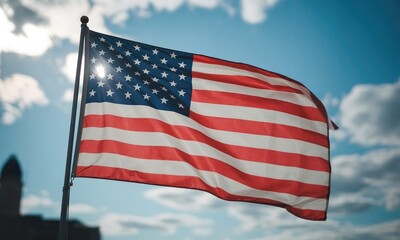 American flag waving in the wind bright sunny day