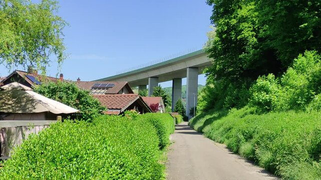 Freeway A 98 behind houses in Germany, medium static shot
