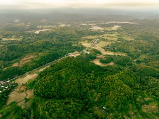 Obraz premium Overhead drone view of tropical forest mountain
