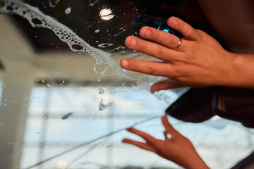 The Professional Windshield Tinting Process Conducted in a Modern Auto Showroom Environment