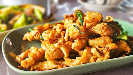 Crispy Fried Food: A mouthwatering plate of crispy fried food, meticulously arranged on a dish,...
