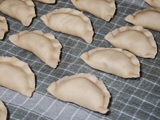 Pierogi ruskie with cottage cheese and potatoes on a cloth