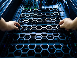 Hands Managing Server Rack Components