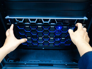 Hands Operating Server with Blue Lights