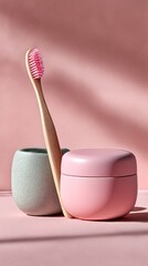 Pink and light green toothbrush and cream containers