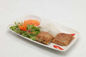 Delicious bowl of bun cha featuring grilled pork, fresh herbs, and rice noodles or Authentic Vietnamese Bun Cha dish with grilled pork. Bun cha Ha Noi