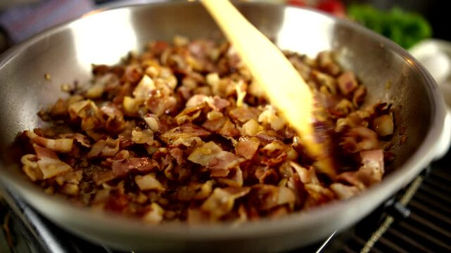 Frying Crispy Bacon Pieces In Pan. Pancetta For Italian Recipe