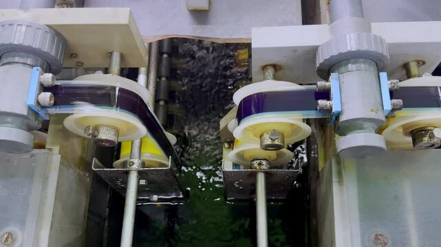 A movie film was running after cleaned in the water tank to next process, film developement process.