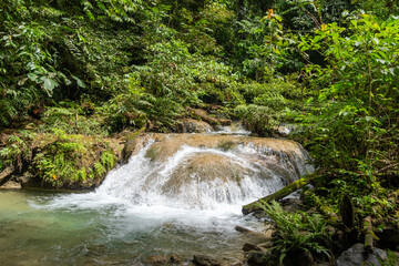 Small river and waterfall in Tentena rainforest, Sulawesi, Indonesia