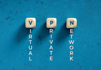 Virtual Private Network acronym spelled on wooden cubes on blue background