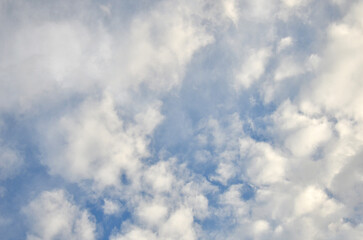 Blue sky with  a lot of fluffy clouds landscape. Sky ,white cloudscape background. Nature, environment, weather.