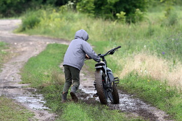 Boy riding a fatbike on a dirt road