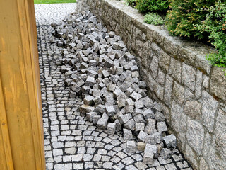 pavers made of stone cubes who can create beautiful mosaics. piles prepared in fine gravel for...