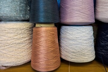 Multicolored Yarn Cones for Textile Production. Assorted Yarn Cones in Various Shades and Textures.
