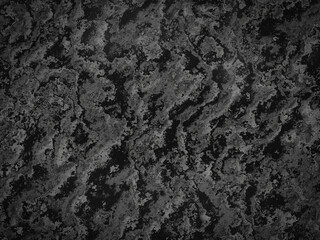 Deep charcoal marble texture with a mix of light and dark patterns, ideal for modern designs.