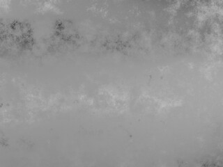 Abstract metal grunge texture with cloudy gray tones and rough surface.