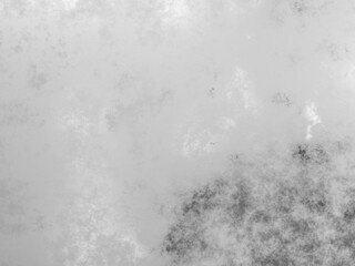 Moody grunge texture with complex dark and light areas blending into a metallic surface.