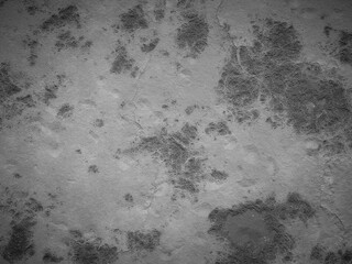 Rough cement texture with faded stains and cracks, creating a worn look.