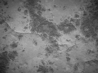 Weathered cement surface with distinct marks and cracks, giving an aged appearance.