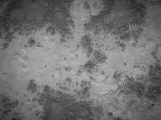 Dark cement surface with rough texture and noticeable discolorations, ideal for industrial backgrounds.