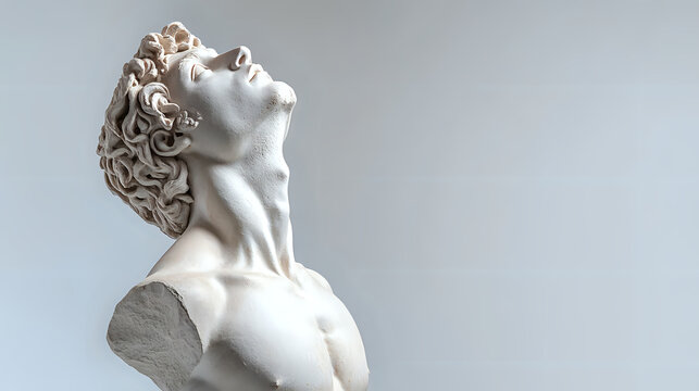 White marble sculpture of male torso with curly hair tilted back in emotional pose against light background, classical Greek and Roman art style statue.
