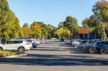 An organized suburban parking lot with clearly marked spaces, speed bumps in Australia. Concept of...