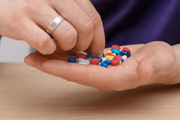 Drug addicted man takes another dose, drug abuse, antiviral drugs and antibiotics