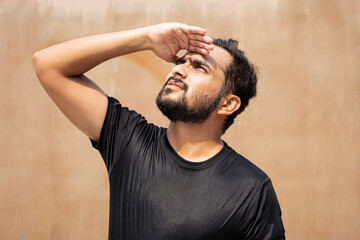 Man Sweating Outdoors: Heat, Sun, and Discomfort