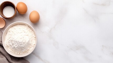 Ingredients for baking on a marble countertop with eggs, flour, and milk ready for preparation
