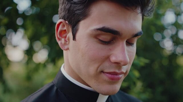 Young priest with eyes closed in serene outdoor setting, symbolizing faith, devotion, spiritual reflection, religious vocation, inner peace, and connection to God in peaceful contemplation