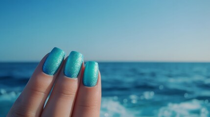 Nails painted in shades of blue and green to represen