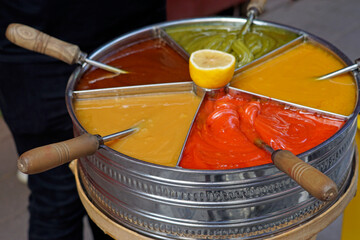 Colorful Turkish macun swirled in container