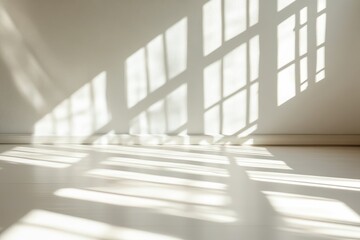 A room with a white wall and a window. The sun is shining through the window, Soft shadows cast by window light reflecting on a plain surface isolated on white background.