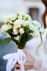Woman with a bouquet of fresh roses