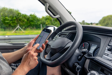 Navigation on smartphone. Drivers hands. Route on mobile screen.