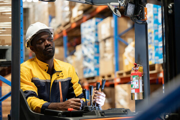 African American male worker driver forklift warehouse in factory. Male worker industrial operate....