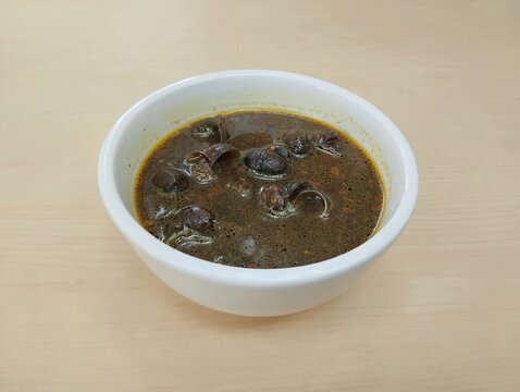 Sayur tutut pucung or snail soup with spices, Indonesian food 