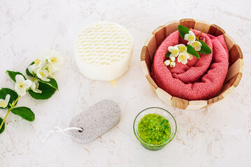 Spa products for facial and body care with soft terry towel.