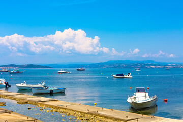 Fototapeta premium Sea panorama, with boats at Athos, Greece