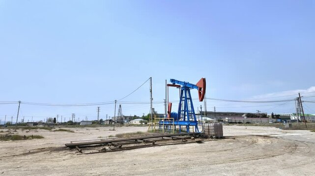 Oil pump extracting crude, symbolizing both the wealth and challenges of relying on finite natural resources in an era of energy transition.