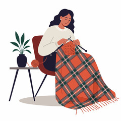 Young woman knitting a plaid blanket while sitting in a chair indoors  
