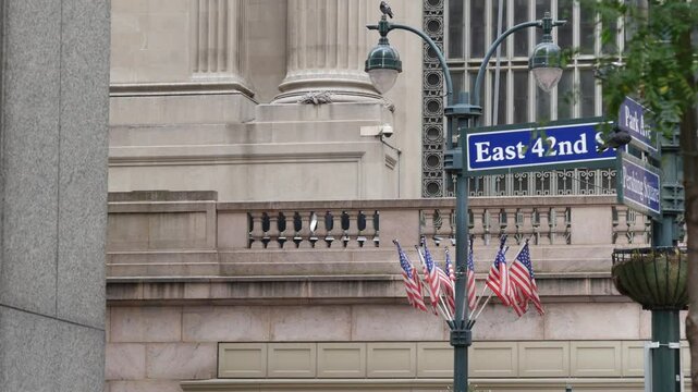New York City Grand Central Terminal, 42 street, Park Avenue, Pershing Square architecture. Midtown district railroad hub, railway transport. NY crossroad corner, intersection road sign, american flag