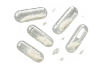 Transparent capsules with white powder filling isolated on transparent backdrop