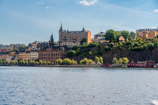 Panoramic view of S�dermalm and Slussen in Stockholm on a sunny summer day with historic architecture along Lake M�laren.