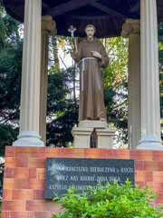 Statue of St. Francis in the garden at the Minor Basilica of Our Lady of Listening Patiently in Rokitno, Poland