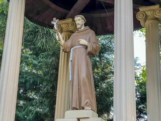 Statue of St. Francis in the garden at the Minor Basilica of Our Lady of Listening Patiently in Rokitno, Poland