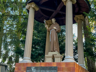 Statue of St. Francis in the garden at the Minor Basilica of Our Lady of Listening Patiently in Rokitno, Poland