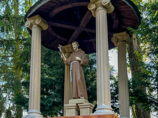 Statue of St. Francis in the garden at the Minor Basilica of Our Lady of Listening Patiently in Rokitno, Poland