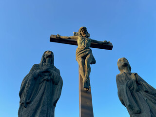 The Lord Jesus on the cross and two women under the cross in the garden at the Minor Basilica of...