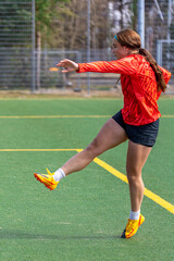 Girl soccer player. Girl in sports uniform on the soccer field. Football concept.